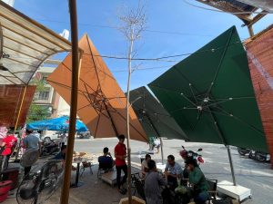 Thay vải bạt áo dù che nắng mưa ngoài trời